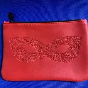 NWOT Ipsy cosmetic bag. Red Floral Eyeglasses imprint. Never used.